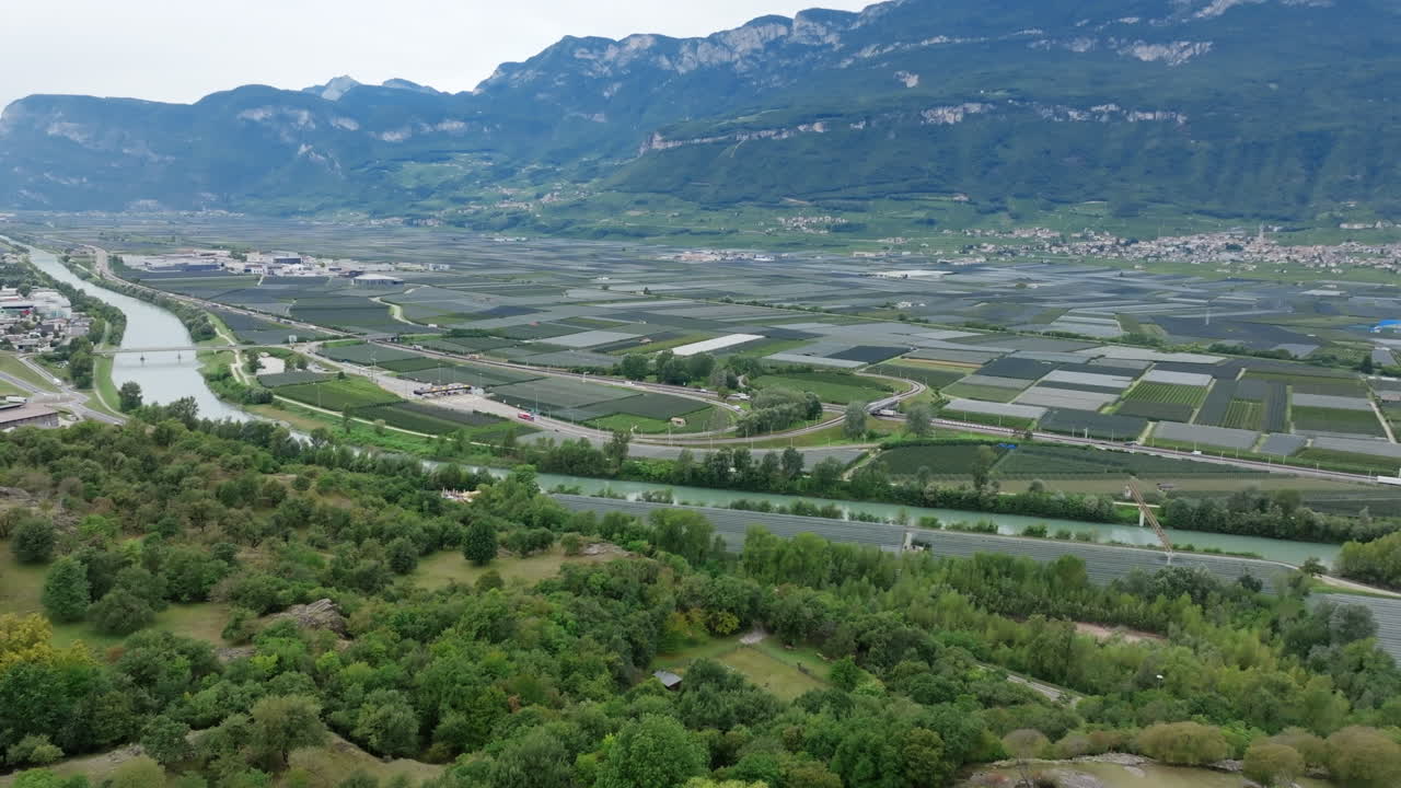 Aerial footage flying over an agricultural valley in northern Italy.