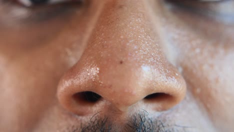 close-up of a person's nose with sweat