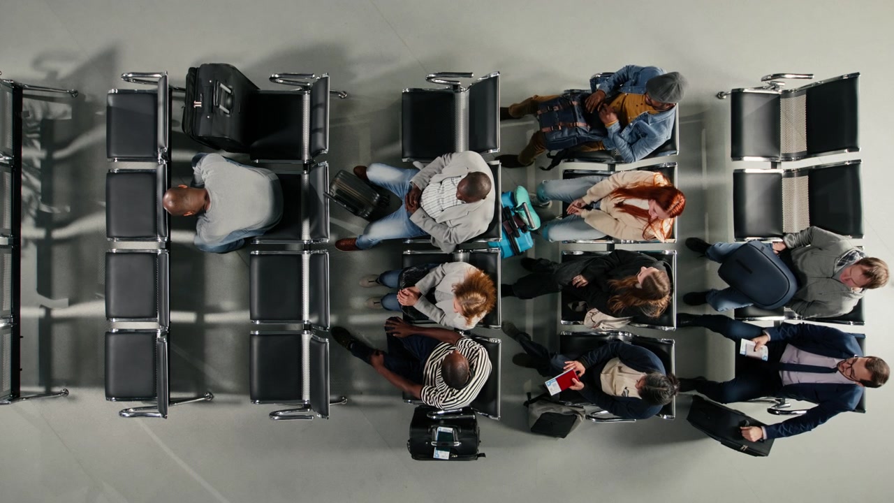 Top down view of multiethnic tourists in airport terminal traveling on vacation