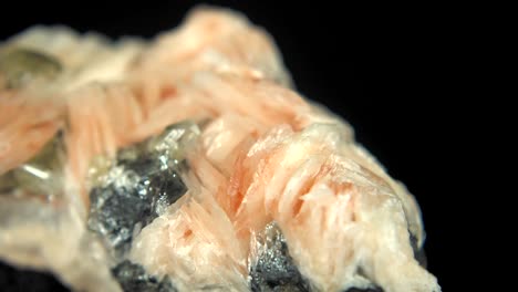 seamlessly rotating a mineral (pink baryte) in front of black background