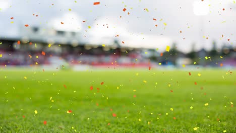 Animation-of-confetti-floating-over-sports-stadium