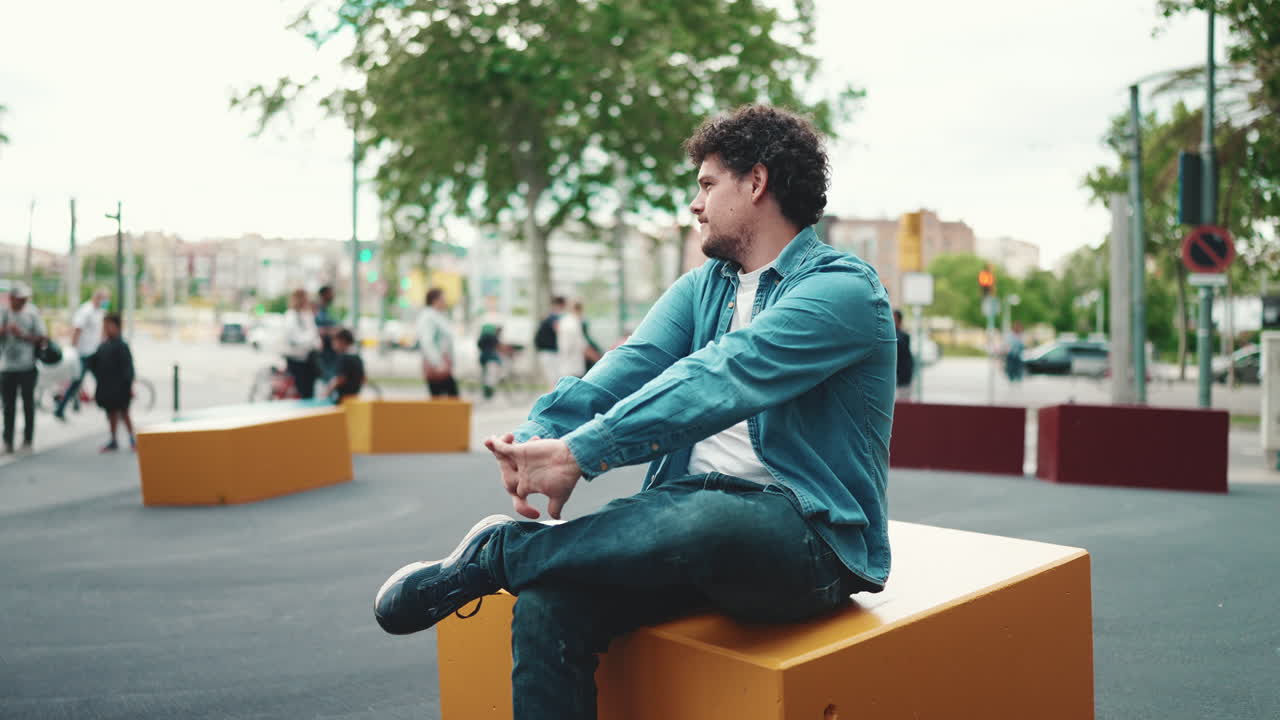 Man sitting in an urban environment