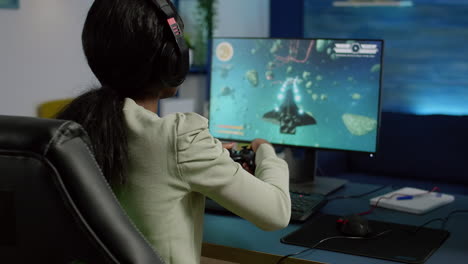 back shot of pro black woman streamer winning graphics cyber space shooter