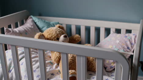 baby crib with teddy bear