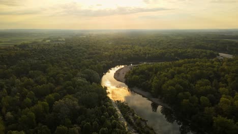 aerial 4k drone footage of lake near ormož. the footage was filmed during the sunrise with beautiful yellow tones.