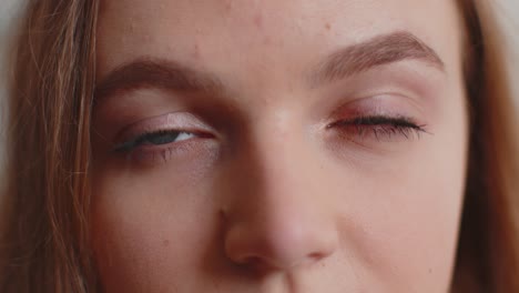 close-up macro portrait of beauty young beautiful woman's eyes, smiling model looking at camera