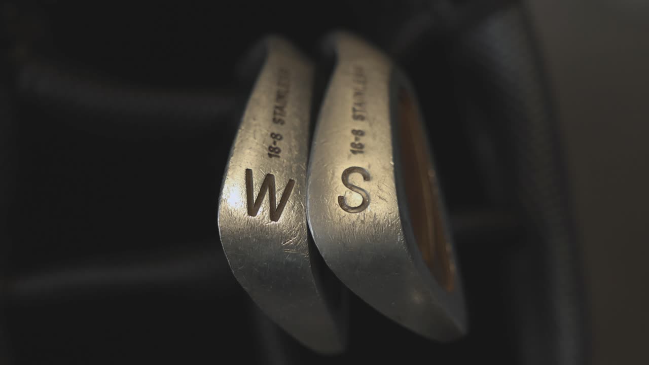 close-up shot of a sand wedge and pitching wedge within a golf bga