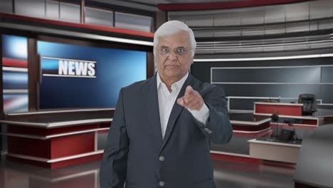 angry indian senior journalist reading news