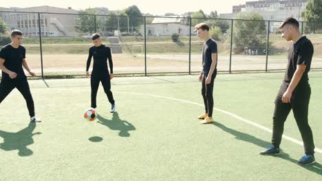 young soccer players training football on the pitch