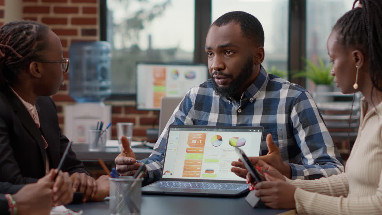 African american team of people collaborating on business strategy