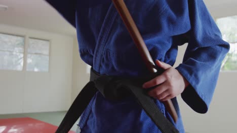 close up view judoka with a wooden saber