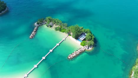 Aerial-drone-landscape-of-crystal-clear-ocean-Ola-beach-club-tropical-reef-Siloso-Sentosa-Island-attractions-Singapore-travel-tourism-Asia