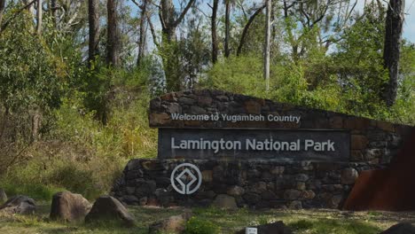 sign at the park entrance amidst trees