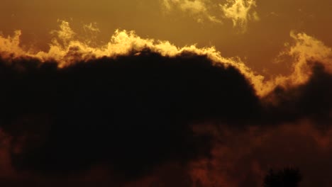 Time-lapse-of-clouds-moving-while-covering-the-sun-during-magic-hour