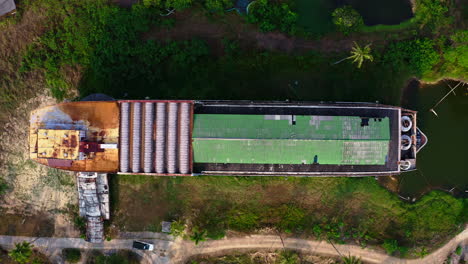 Rusting-boat-bridge-and-deck-of-Koh-Chang-ghost-ship-in-marshy-lagoon