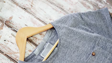 t-shirt on wooden plank