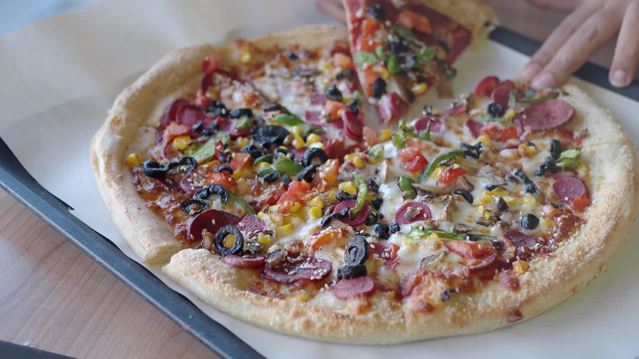 Person Eating a Delicious Pizza