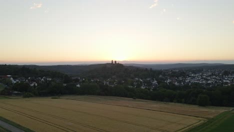 Closing-Shot-Of-A-Beautiful-Farmers-Field-With-Braunfels-Castle-Blocking-The-Horizon