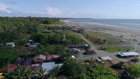 drone shot of rural homes on the beach of la barra in the colombian pacific, near juanchaco and ladrilleros