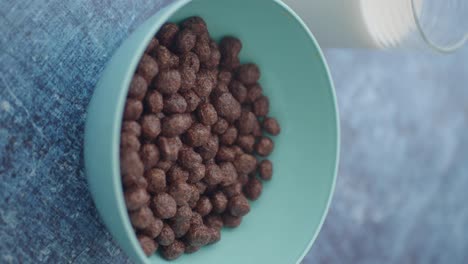 bowl of chocolate cereal with milk ready for breakfast