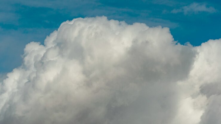 Clouds billowing and blowing along the horizon - close, tight composition time lapse
