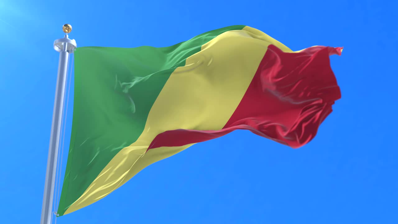 Flag of the Republic of the Congo waving at wind with blue sky in slow, loop
