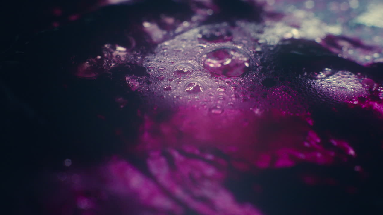 Colourful, organic, liquids macro shots buzzing and flowing