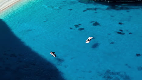 Boats-on-mediterranean-sea-clear-blue-water,-Zakynthos-Ionian-islands,-Greece