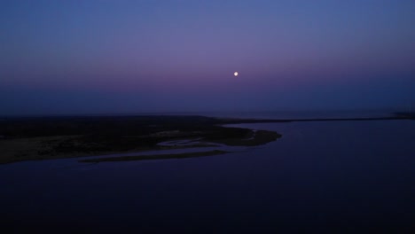 calm waters of brielse meer at nighttime. aerial