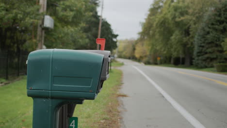 a mailbox by the road. typical for the suburbs of the united states