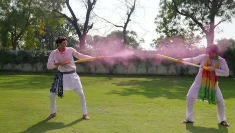 indian boys celebrating holi in a park