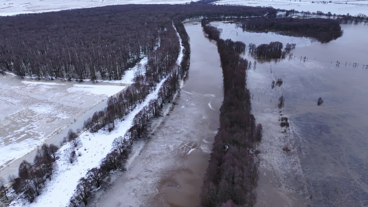 An aerial view of the old riverbed, which has overflowed its banks and flooded meadows, fields, and forests. Europe Lithuania