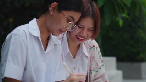 two young women studying together