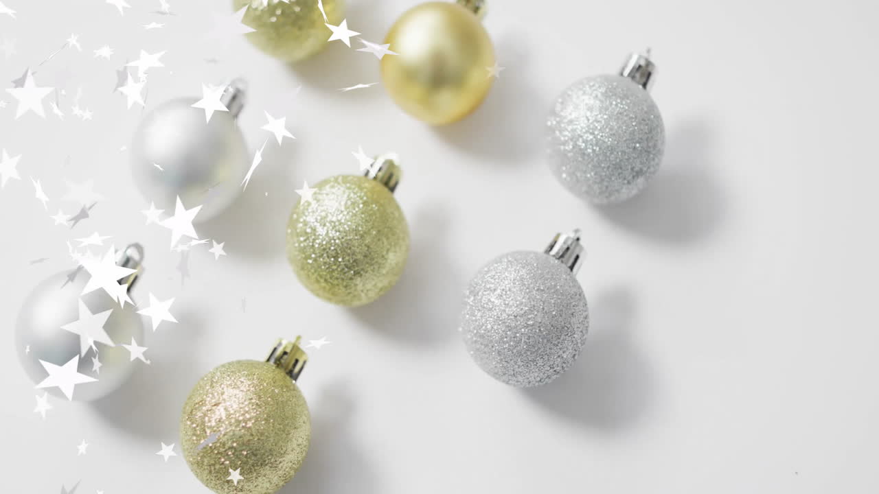 Glittering star animation with Christmas ornaments on white background
