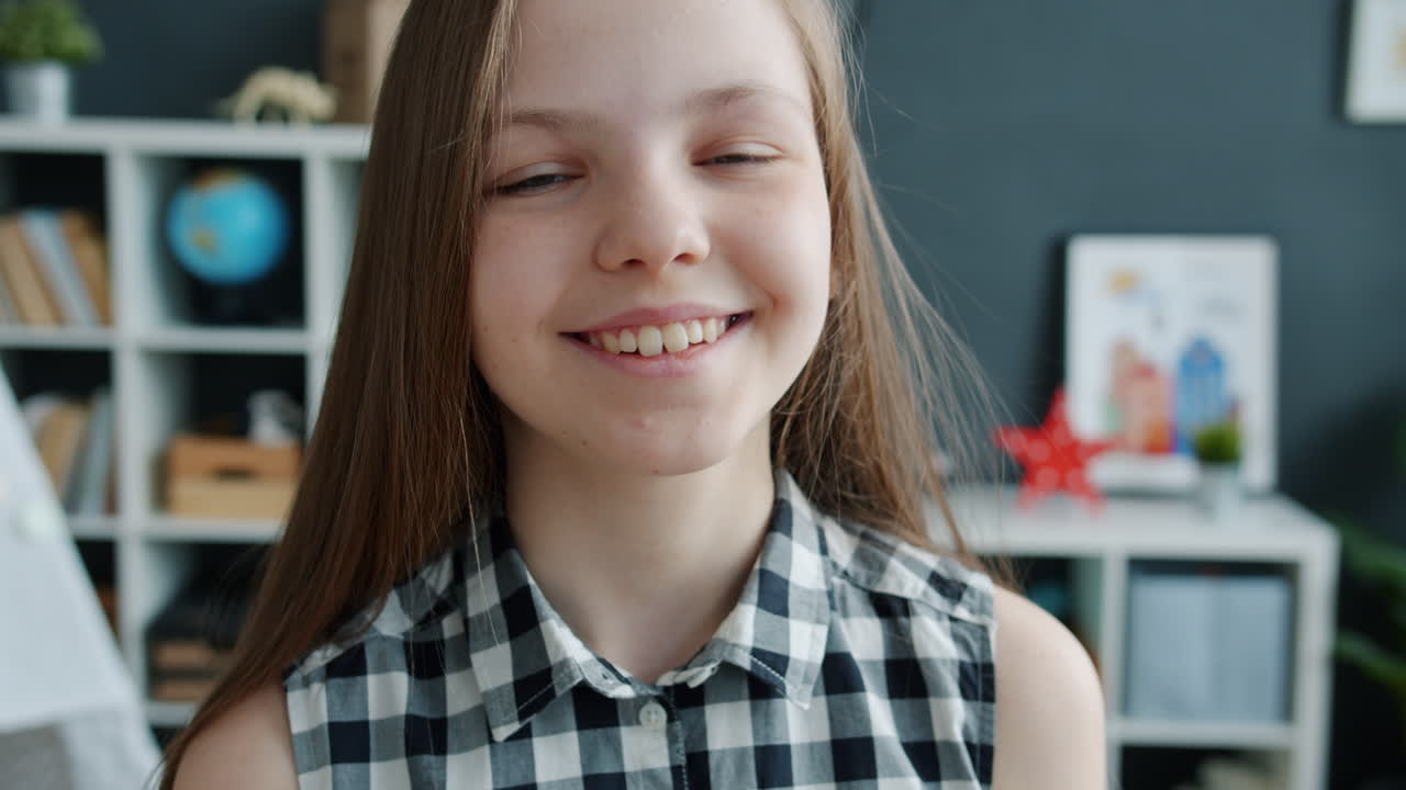 Smiling Teenage Girl in a Room
