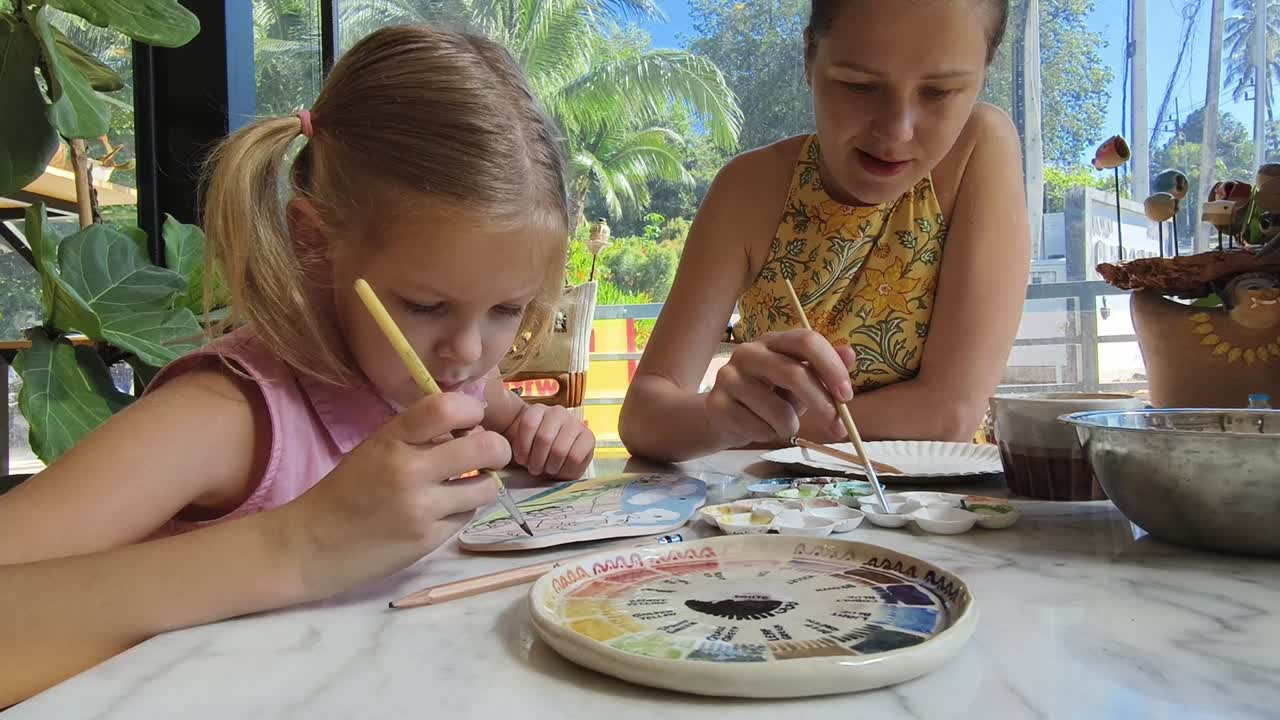 Mother and Daughter Painting Pottery