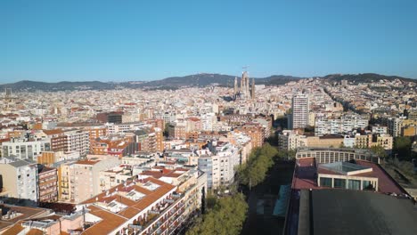 aerial boom shot reveals beautiful sagrada familia, barcelona, spain