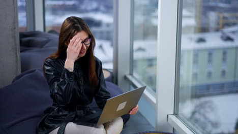 woman on video call in modern office