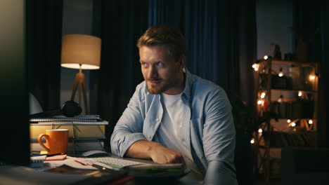 Happy-guy-waving-hand-closeup.-Man-making-video-call-at-night-apartments-alone