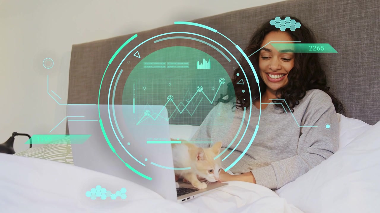 Woman typing in bed, kitten appearing climbing keyboard, tech HUD graphs over laptop, on break