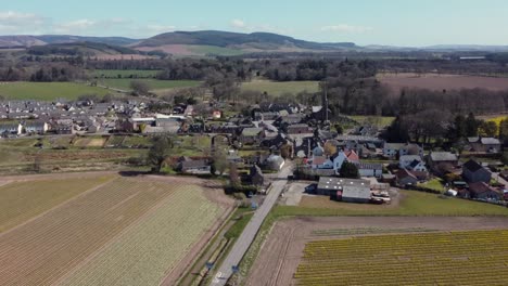 Aerial-view-of-the-Scottish-town-of-Fettercairn-on-a-sunny-spring-day,-Aberdeenshire,-Scotland
