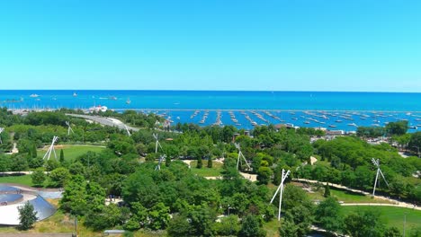 aerial shot over pritzker pavilion flying to lake michigan | chicago illinois | afternoon lighting