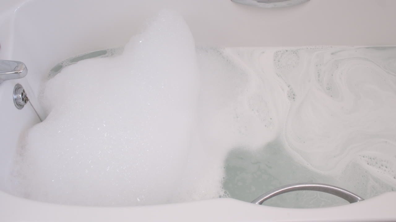 Relaxing Bubble Bath in a White Bathtub