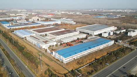 aerial view of a chinese factory located on the industrial outskirts of linyi, shandong province, china on a sunny day