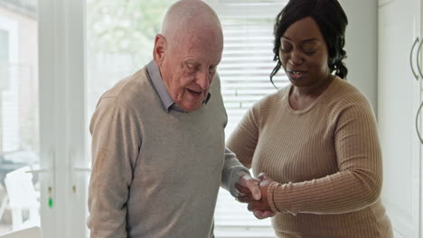 elderly man receiving help from a home caregiver