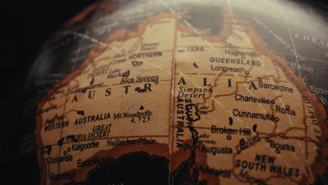 close-up of an antique world globe, focusing on australia