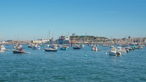 boats moored in the harbour during falmouth week celebration in cornwall, uk