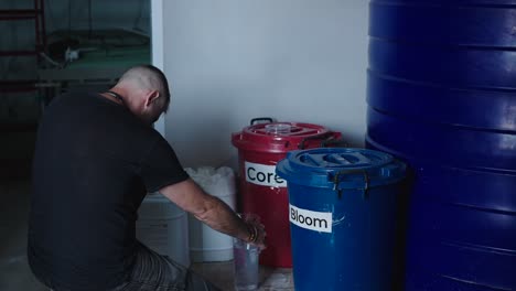 worker transferring liquids in a medical facility