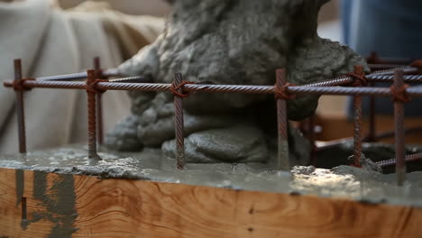 pouring concrete into formwork with rebar