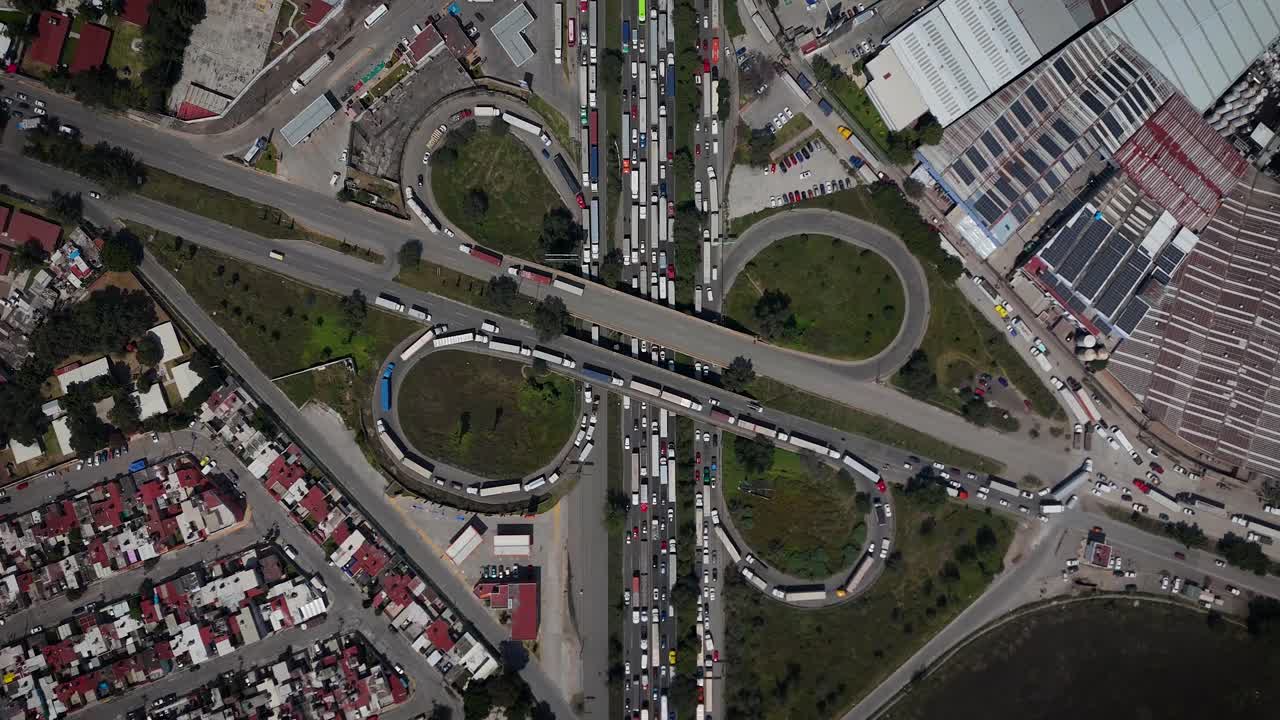Aerial drone footage with close-up view of a major traffic jam at the highway interchange on the Mexico–Querétaro route in Cuautitlán Izcalli, State of Mexico, near Mexico City metropolitan area